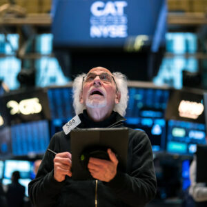 A trader reacts as he works on the floor of the New York Stock Exchange