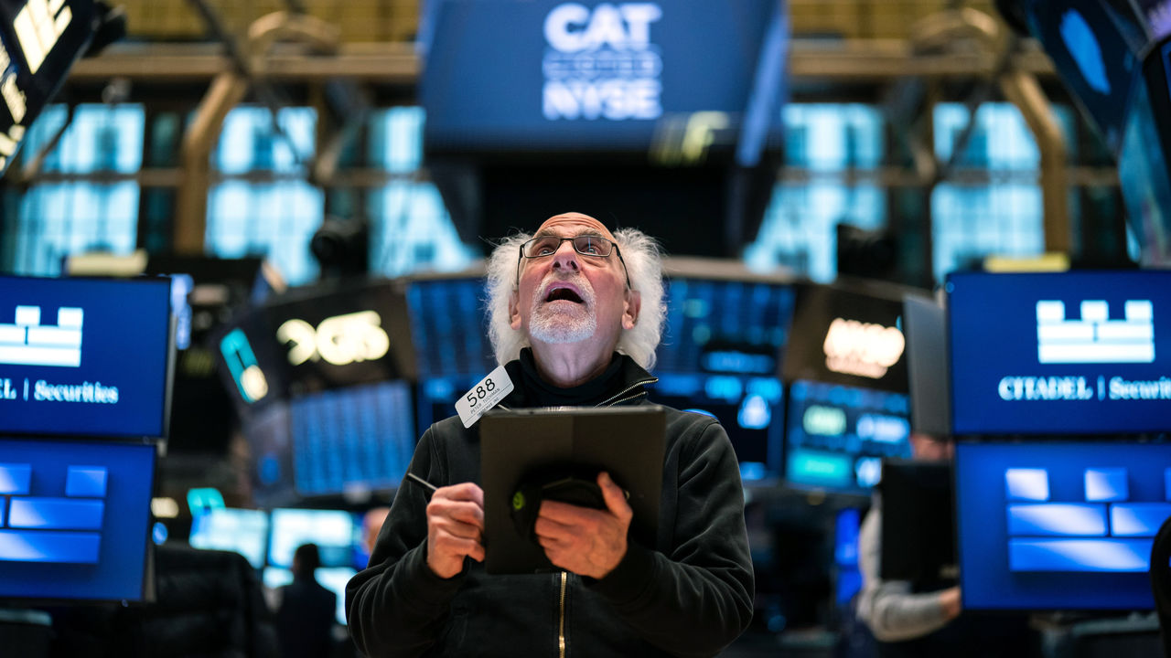 A trader reacts as he works on the floor of the New York Stock Exchange