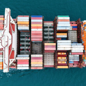 A container ship sails off a port in Qingdao, China.