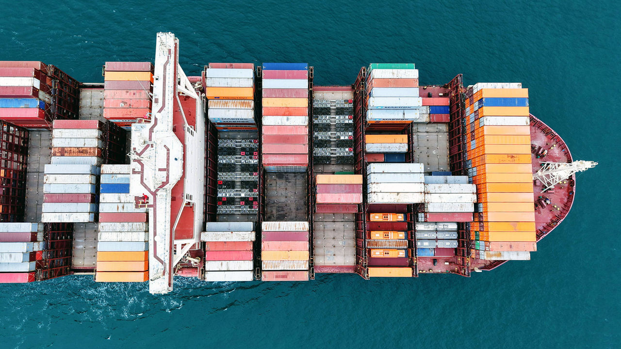 A container ship sails off a port in Qingdao, China.