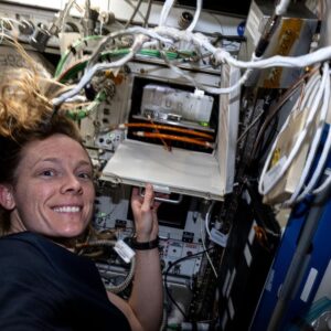 Astronaut Nichole Ayers shows off a research incubator that enables biology investigations into the effects of microgravity on cells, microbes, plants, and more